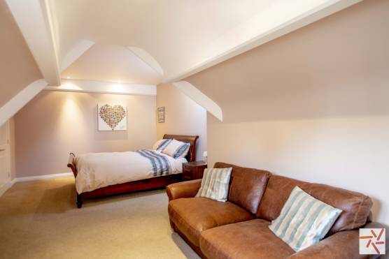 3248C 20 tv drama location house in cheshire bedroom with living area.jpg