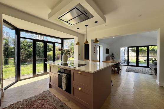 3528W 4 tv shoot location house in West Yorkshire modern open plan pink kitchen with kitchen island.jpg
