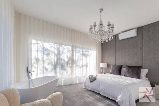 3383V 14 tv commercial location house in Merseyside contemporary white villa with large bedroom with stand alone bath