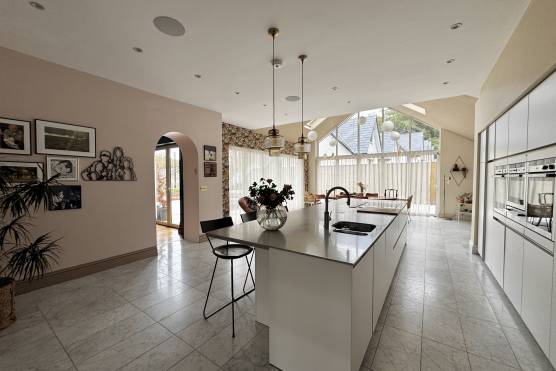 3556M 11 filming location house in Manchester modern open plan white kitchen.jpg