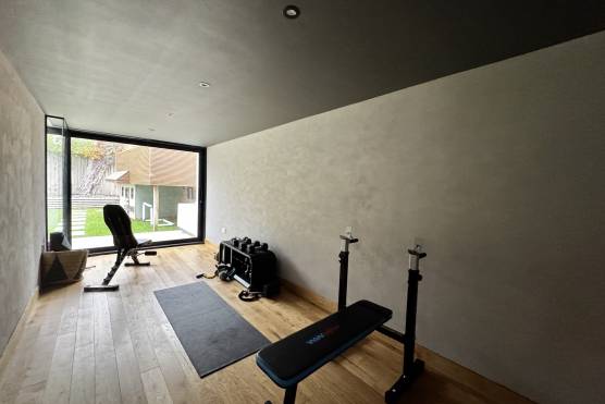 3556M 25 filming location house in Manchester home gym.jpg