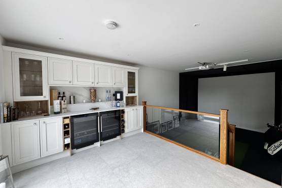 3561V 25 filming location house in Merseyside home bar and golf simulator.jpg