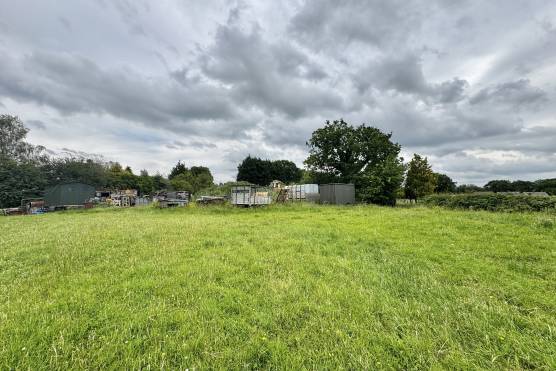 3565L 17 tv commercial location house in Lancashire field with scrap yard.jpg